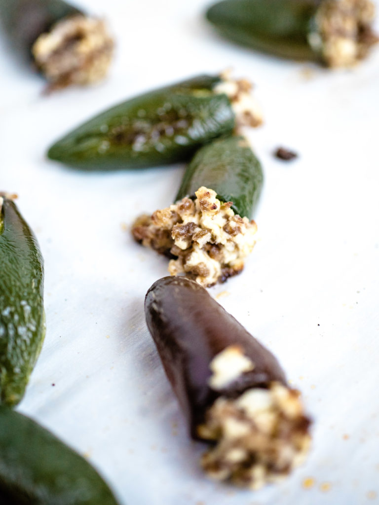 up close shot of oven roasted stuffed jalapenos showing it from the top of the jalapeno