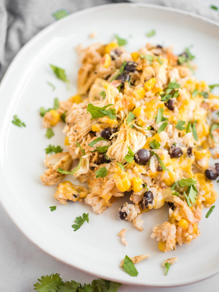 up close shot of tex mex chicken and rice casserole on white plate