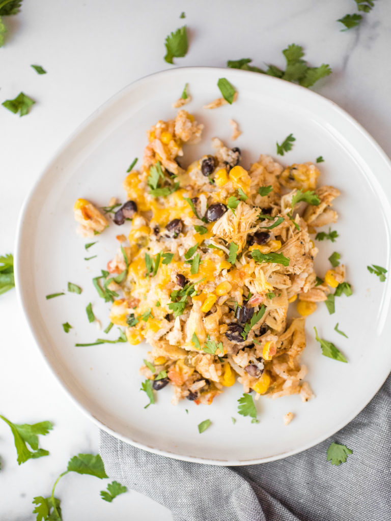 overhead shot of tex-mex chicken & rice casserole topped with cilantro