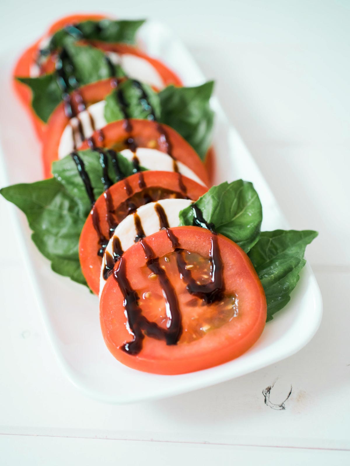 caprese on a white plate