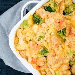 Cheesy Chicken and Veggie Bubble Up in a white baking dish