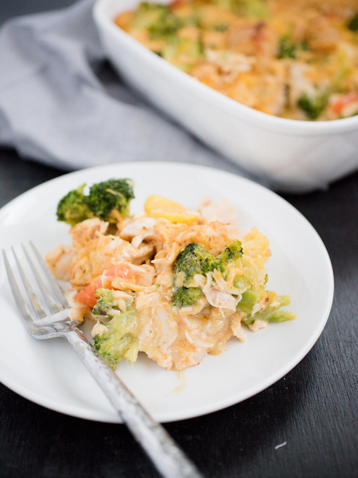 serving of Cheesy Chicken and Veggie Bubble Up on a white plate with a fork