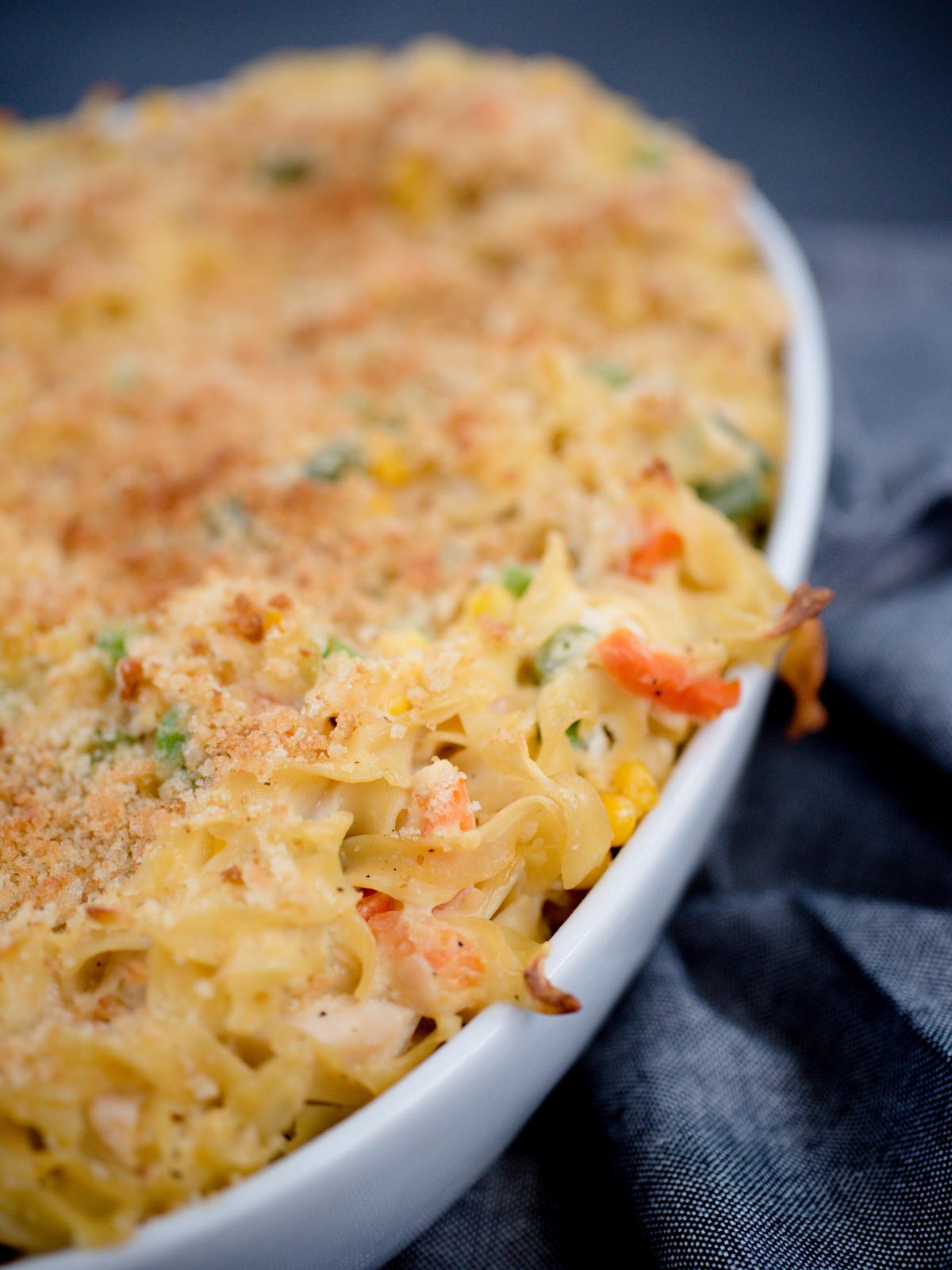 chicken noodle casserole in a white baking dish