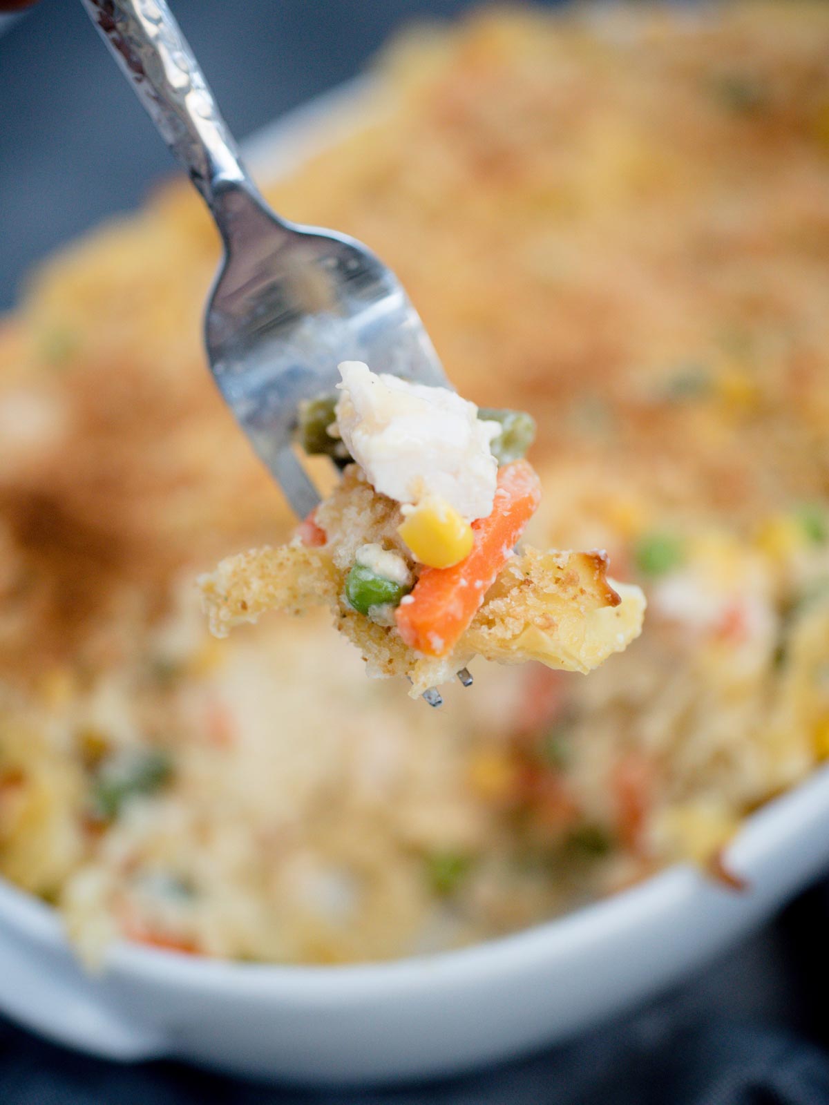 chicken noodle casserole serving on a fork