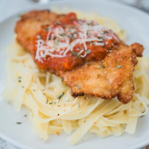 chicken parmesan on top of pasta