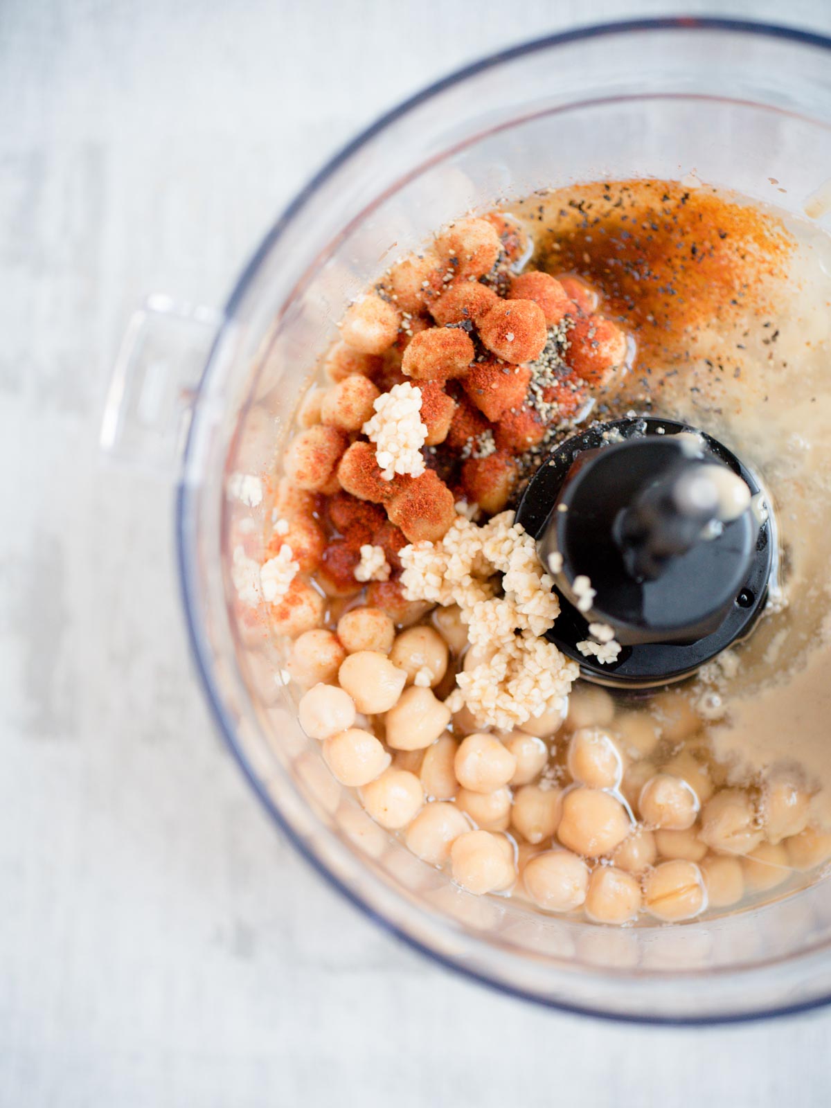 ingredients for homemade hummus in food processor