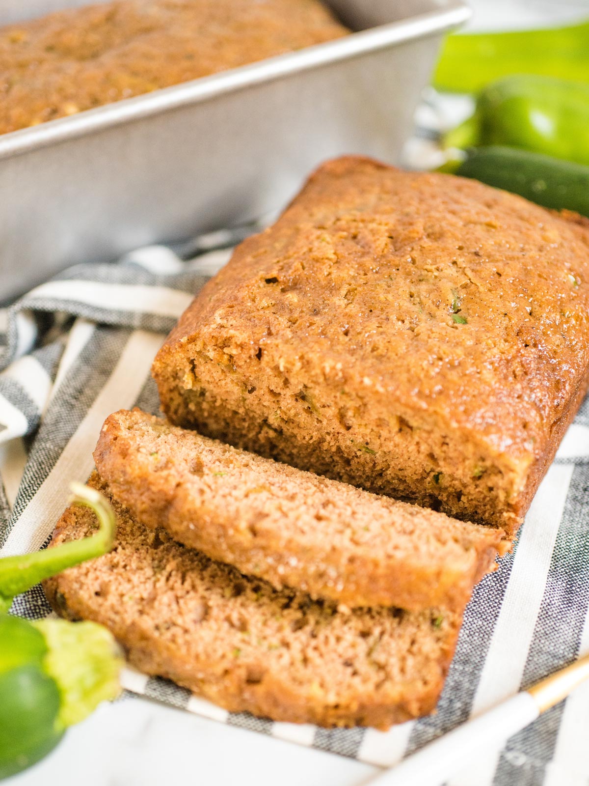 up close shot of sliced zucchini bread with green chile