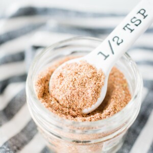 homemade taco seasoning in a jar with a measuring spoon