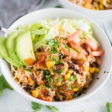 a bowl of instant pot chicken burrito bowl with toppings