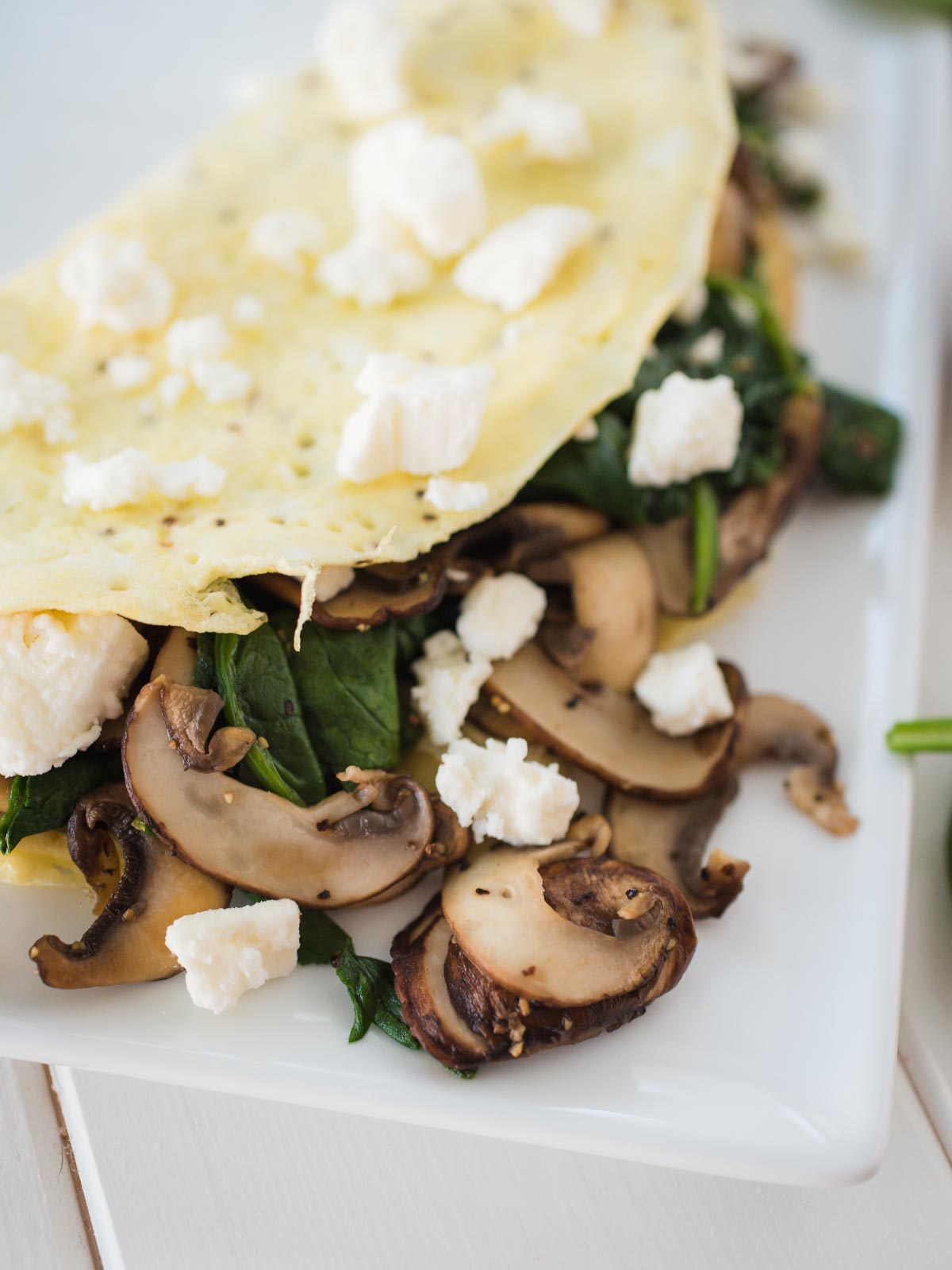Spinach Mushroom and Feta Omelet on a white plate