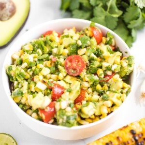 summer corn salad in a white bowl