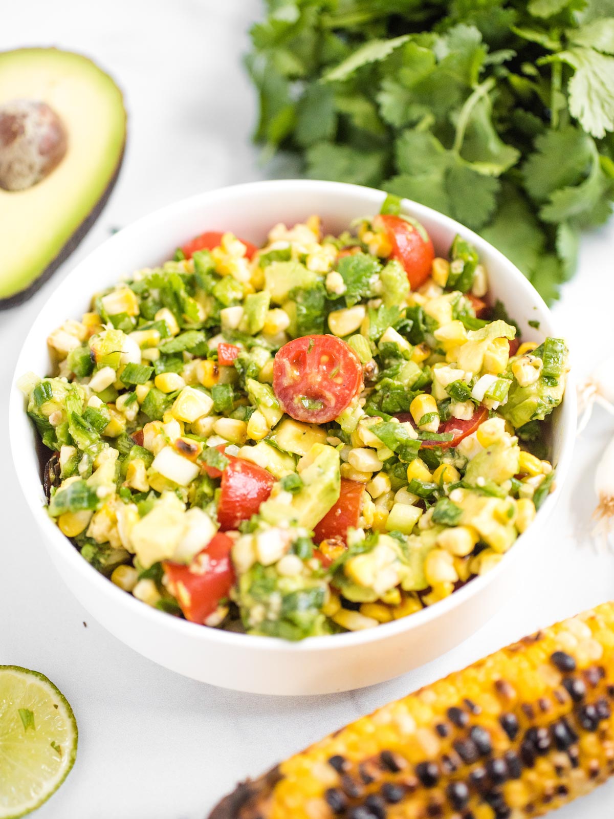 summer corn salad in a white bowl