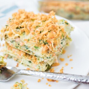 A serving of vegetable lasagna with a fork