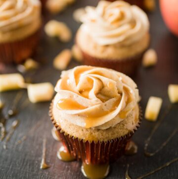 apple cider cupcake with cinnamon sugar frosting drizzled with caramel