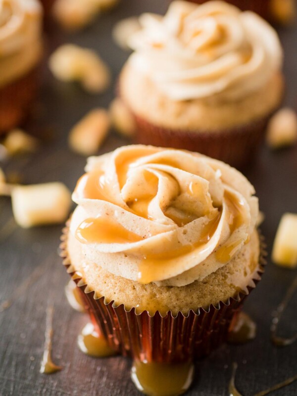 apple cider cupcake with cinnamon sugar frosting drizzled with caramel