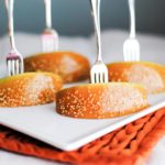 caramel apple bites on a plate with an appetizer fork