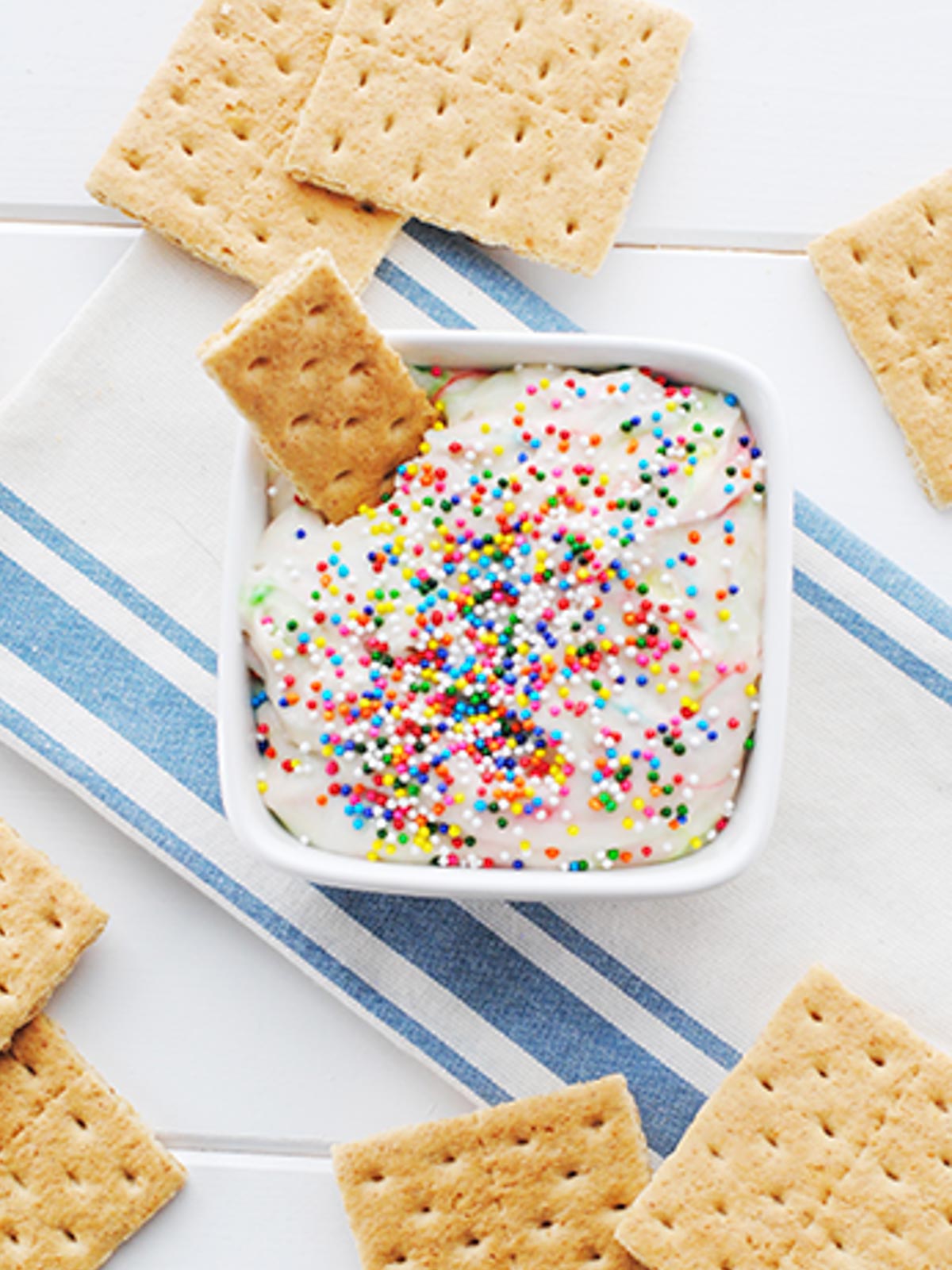 funfetti cake batter dip topped with sprinkles