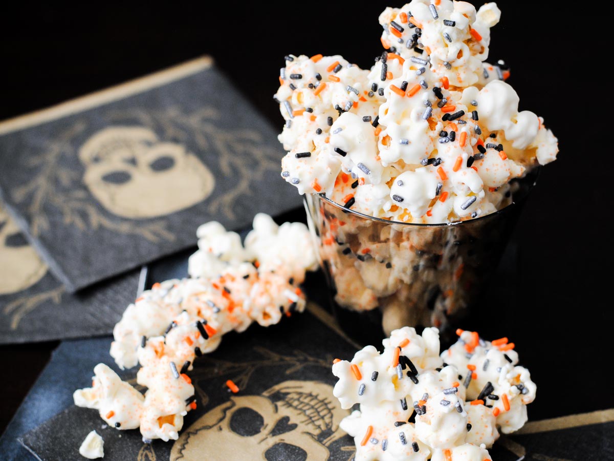 poison popcorn in a cup on a skull napkin