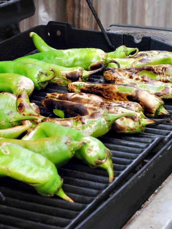 green chiles roasting on a grill
