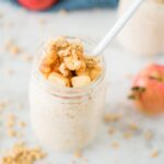 jar of apple pie overnight oats with spoon