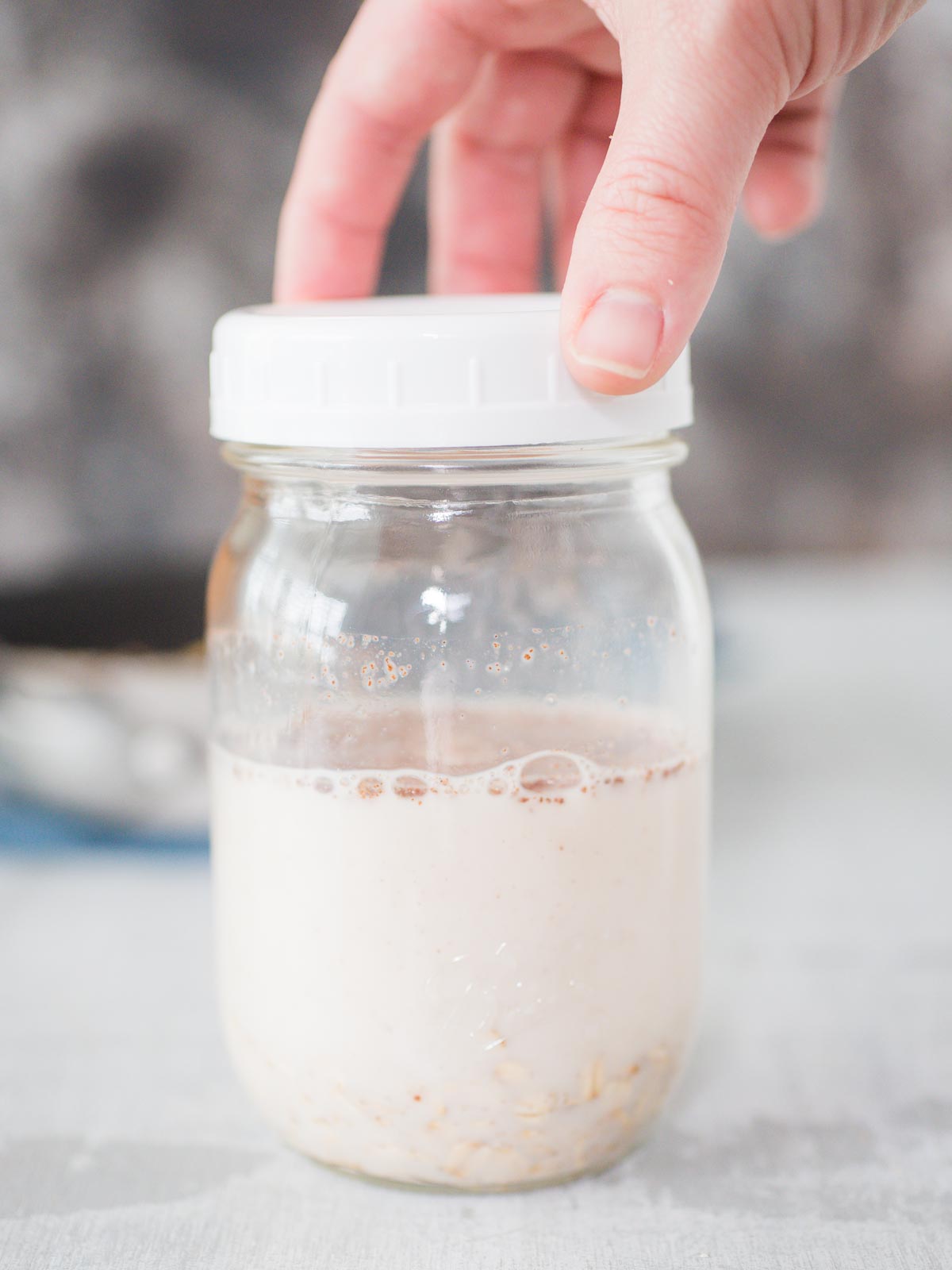 lid being put on a jar