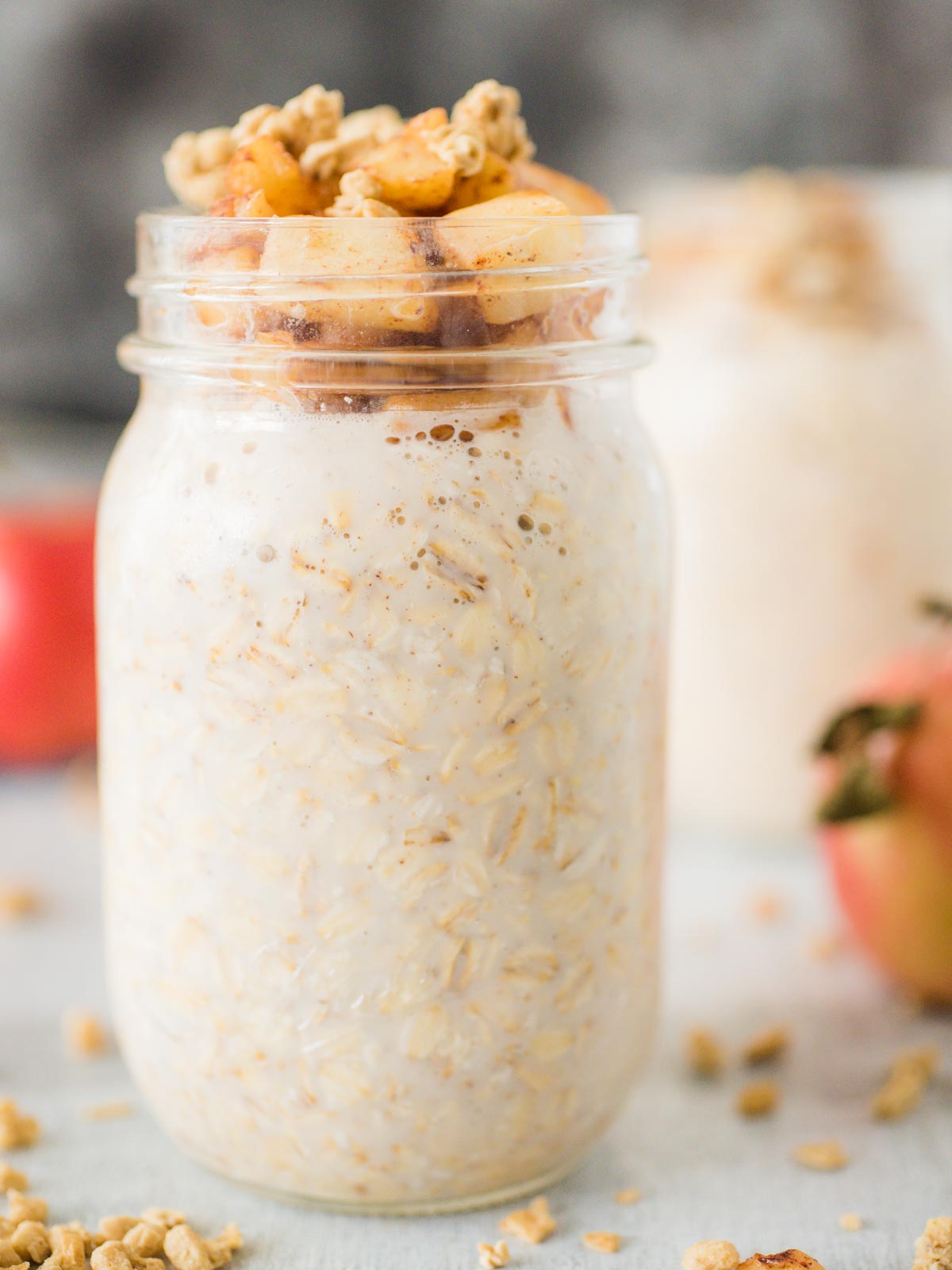 jar of apple pie overnight oats topped with granola