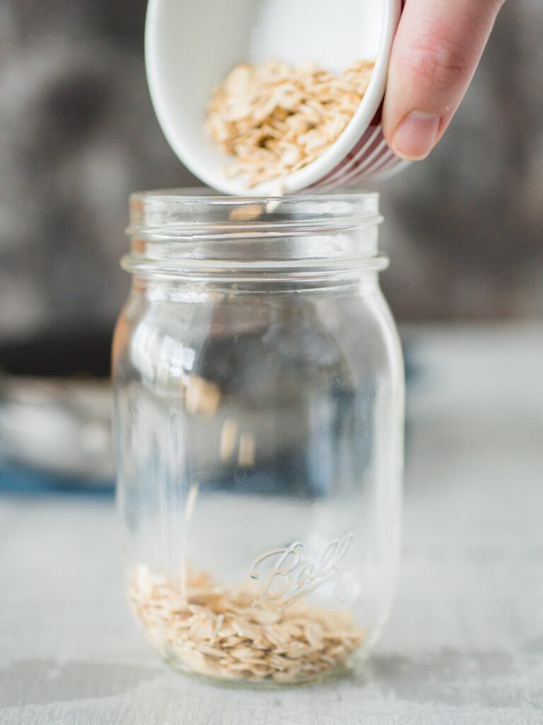oats being poured in jar