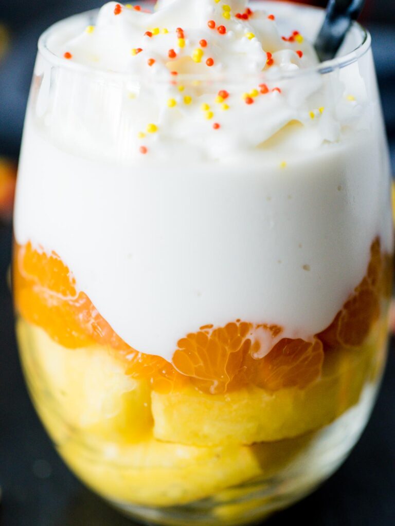 candy corn inspired fruit parfait in a glass