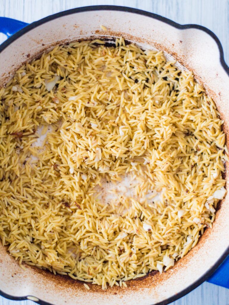 toasting orzo in a skillet