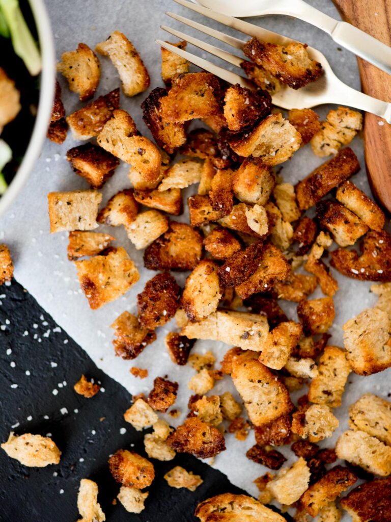 Homemade Croutons in the Air Fryer on parchment paper