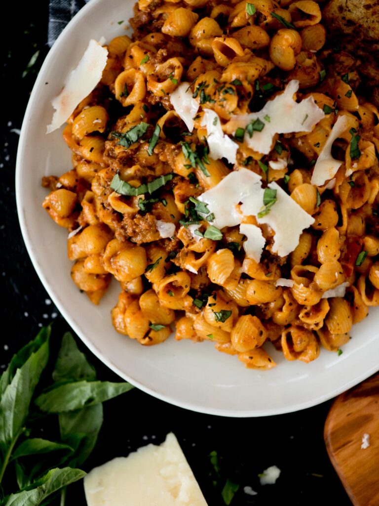 Instant Pot Ground Beef and Pasta with basil and shaved parmesan