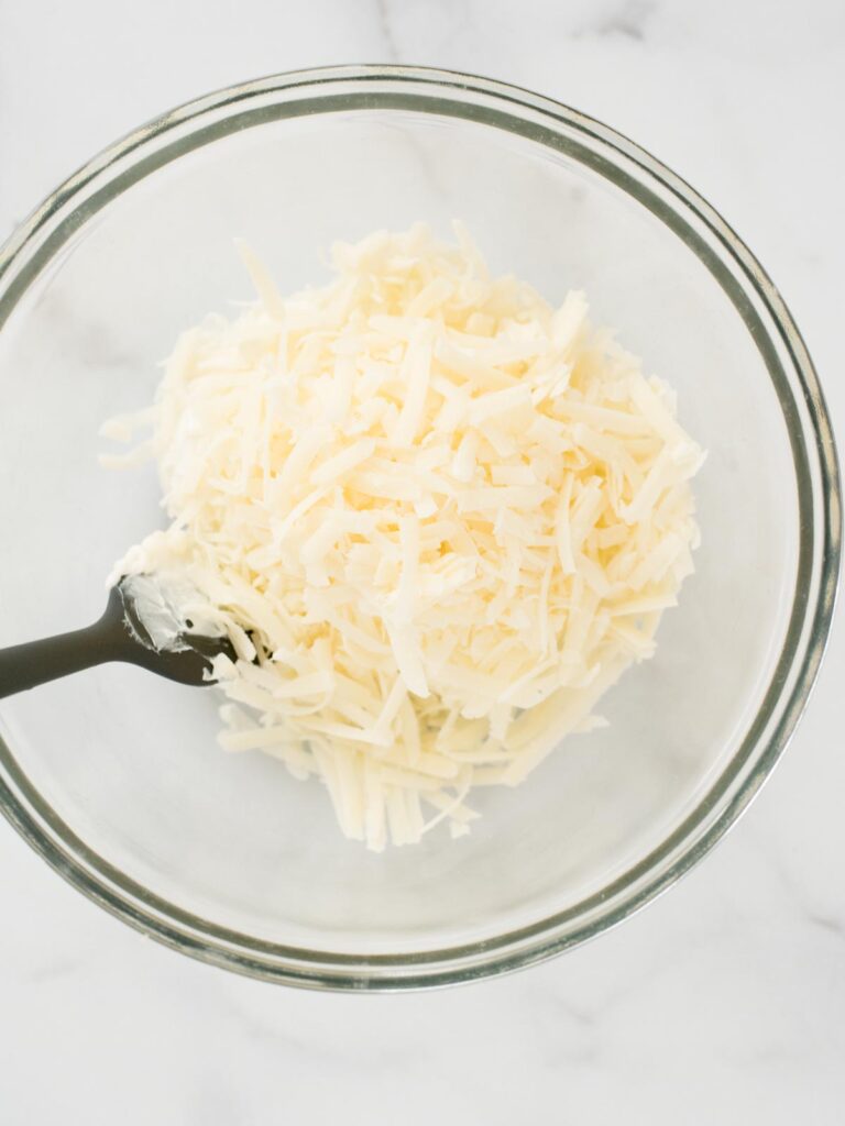 parmesan added to bowl