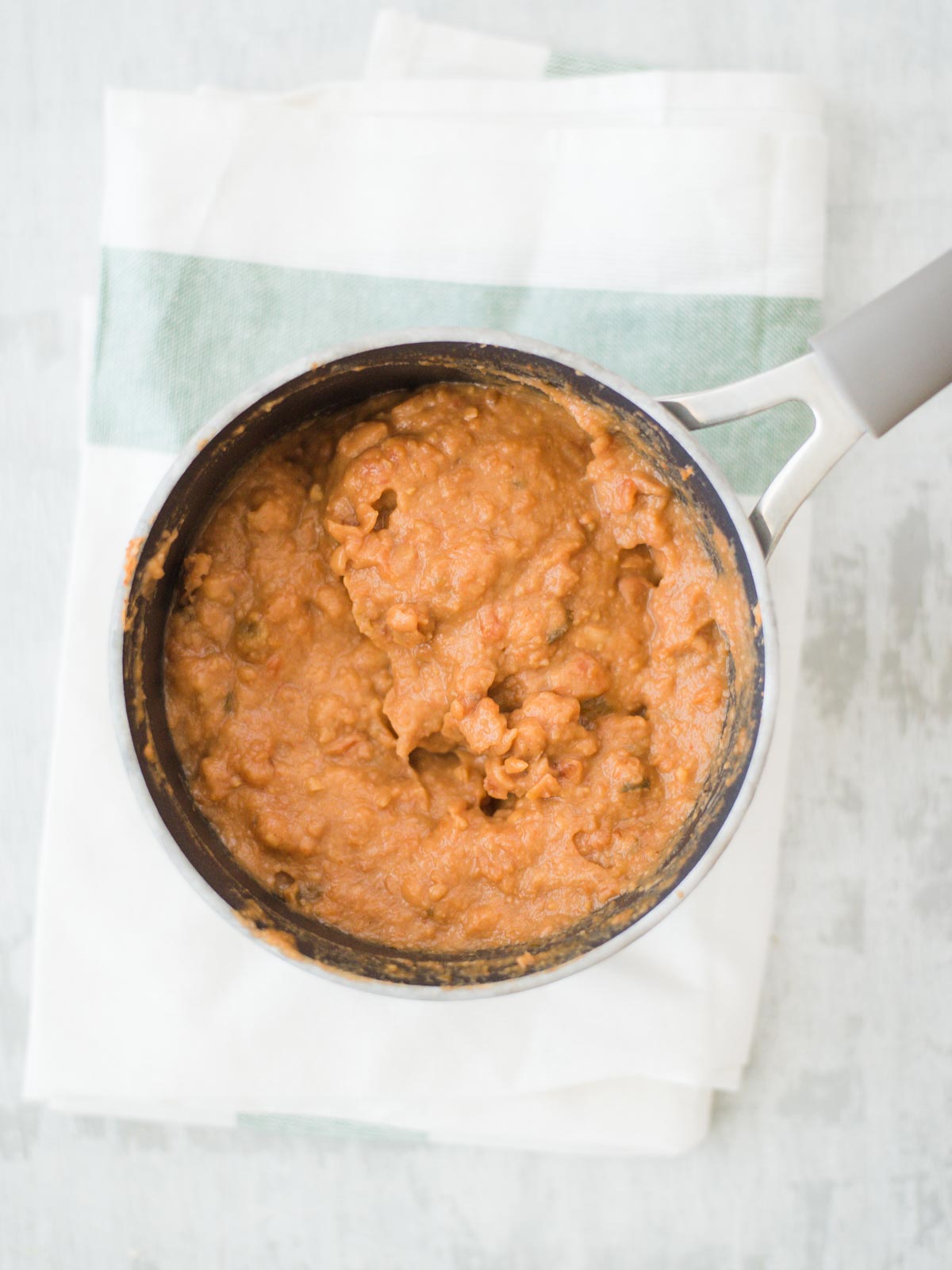 refriend beans in sauce pan