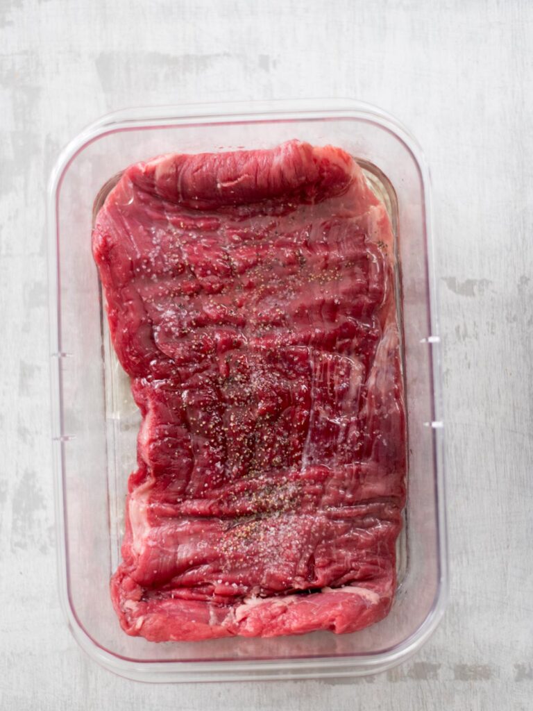 more seasonings added to flank steak