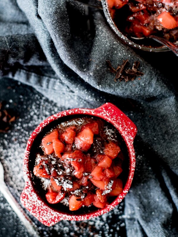 Chocolate Mug Cake with Sweet Strawberry Topping and powdered sugar