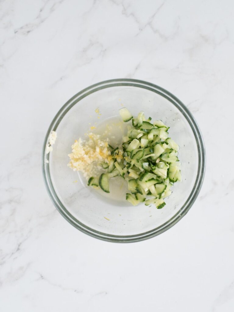 english cucumber, lemon zest, lemon juice, and garlic in a mixing bowl