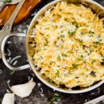 parmesan orzo topped with fresh herbs and parmesan