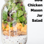 glass mason jar filled with bbq chicken mason jar salad