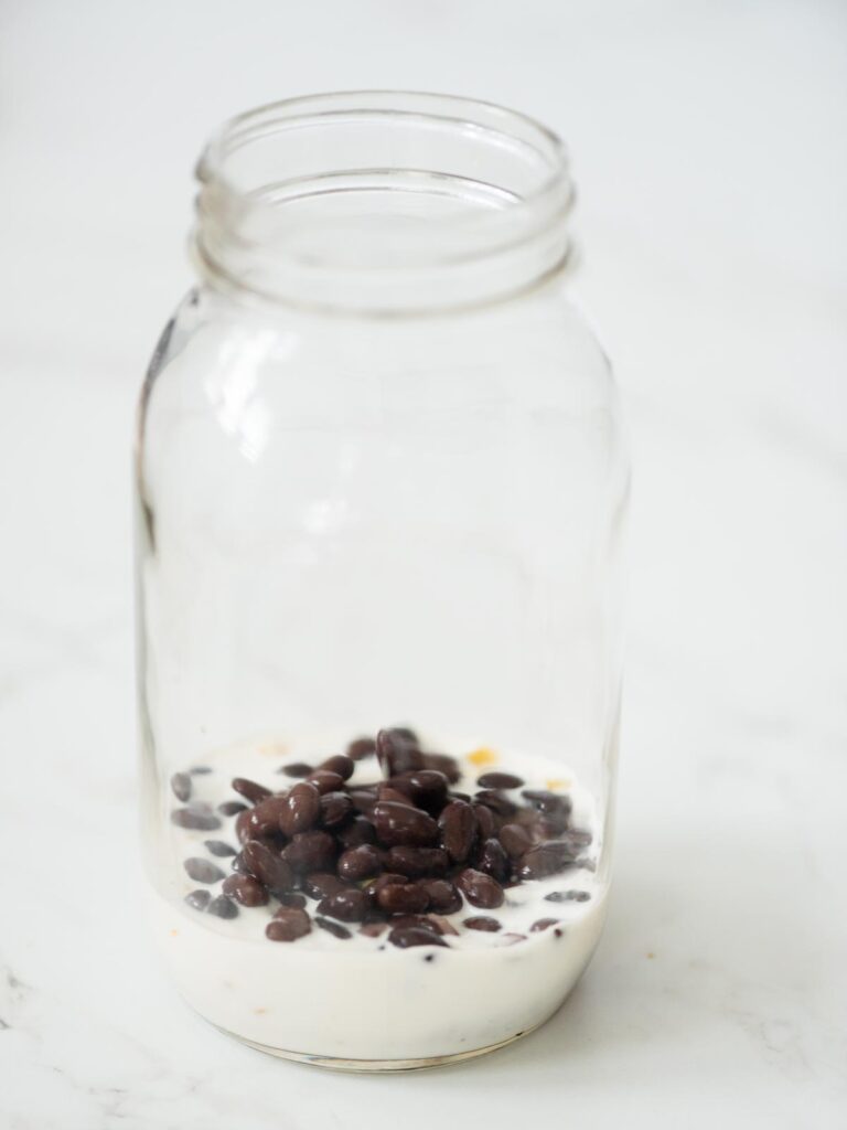 black beans added to the mason jar