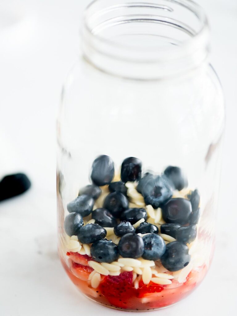 blueberries added to the mason jar with the other ingredients