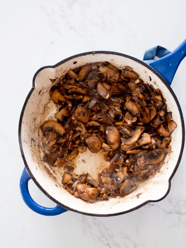 sauteed garlic, onions, and mushrooms in a skillet