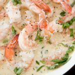 creamy garlic shrimp with parmesan in an enamel cast iron skillet