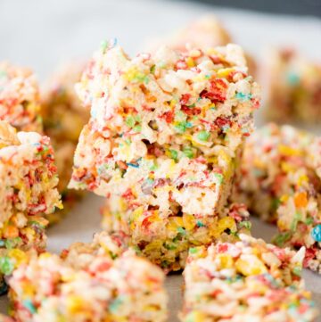 fruity pebbles rice krispie treats stacked on top of each other