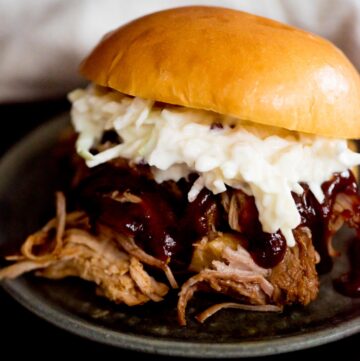 instant pot sweet pulled pork with bbq sauce and coleslaw in a brioche bun