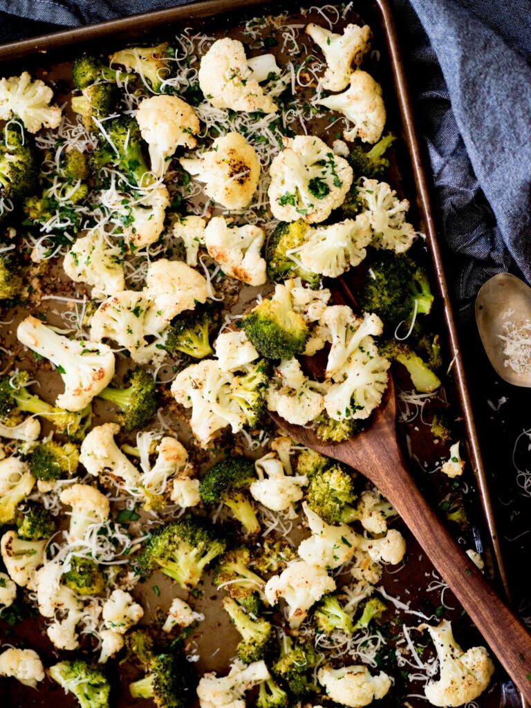 garlic parmesan roasted cauliflower and broccoli on a sheet pan