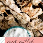 pinterest graphic with text showing greek grilled chicken skewers with tzatziki sauce