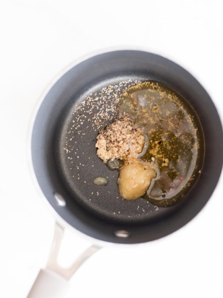 garlic, ginger, salt, pepper, and honey in a saucepan