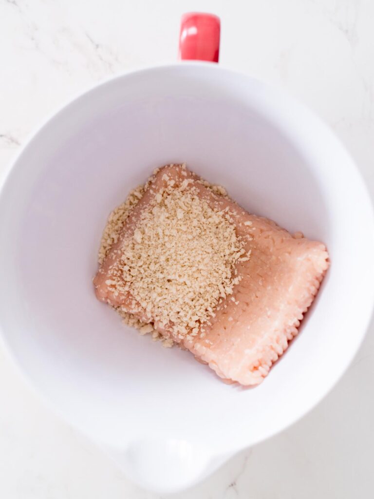 ground chicken and panko breadcrumbs in a mixing bowl