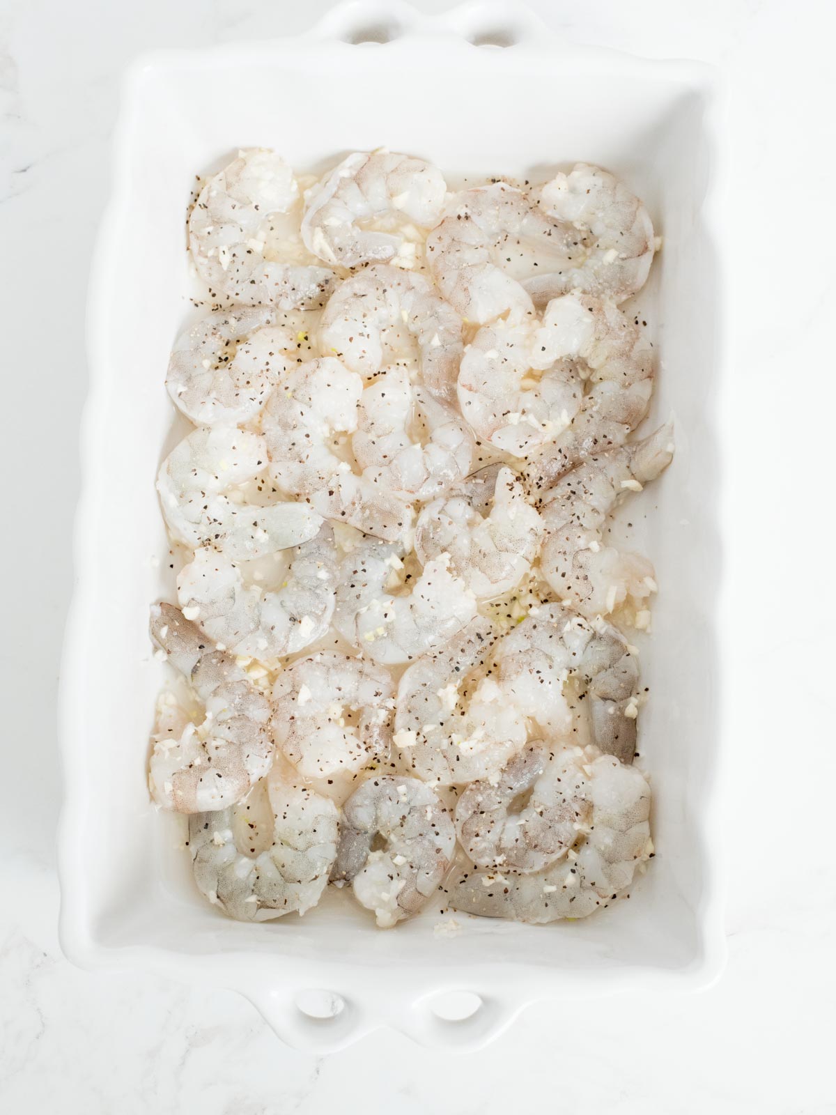 baked shrimp scampi base of shrimp garlic and wine in a 9x13 baking dish seasoned with salt and pepper