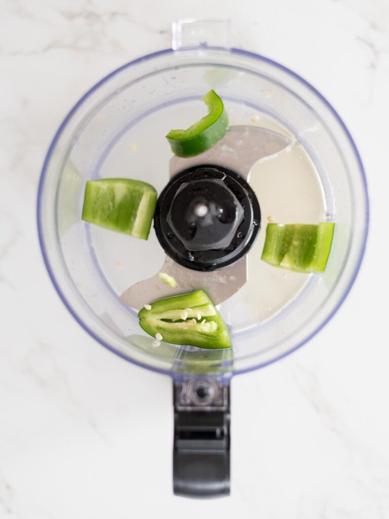jalapeno, honey, and lime in a food processor